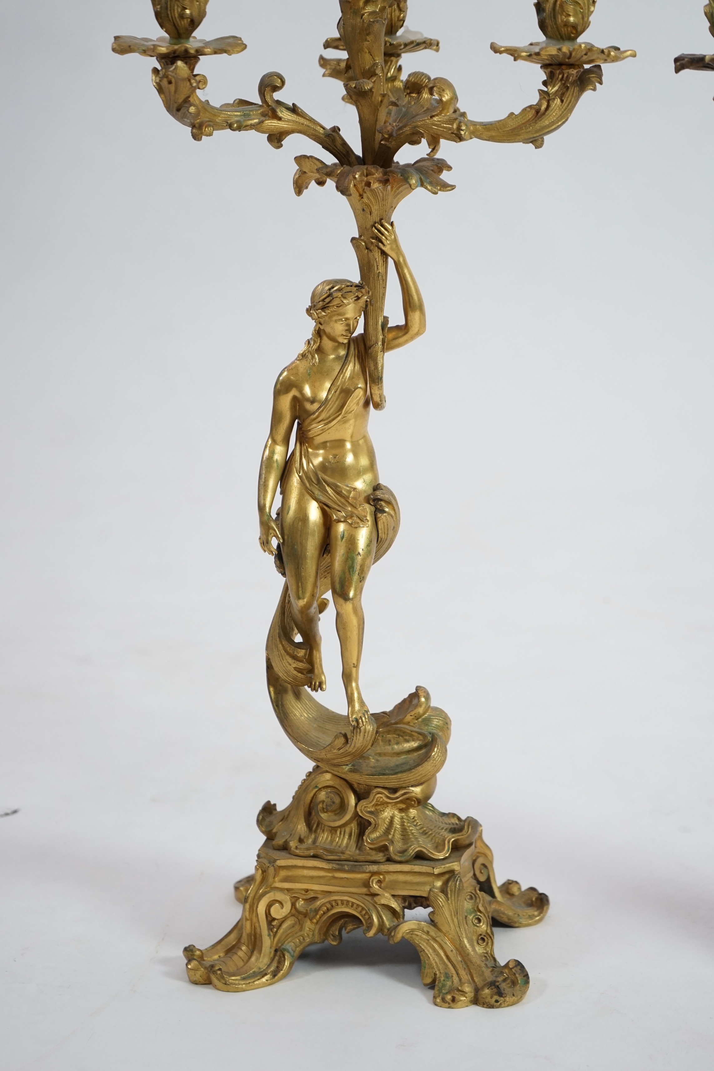 A pair of 19th century French ormolu five light ‘Venus’ figural candelabra